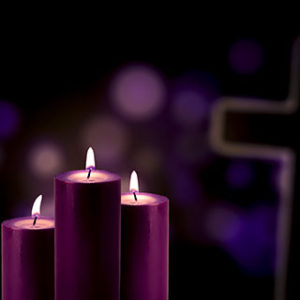 Purples candles with a cross